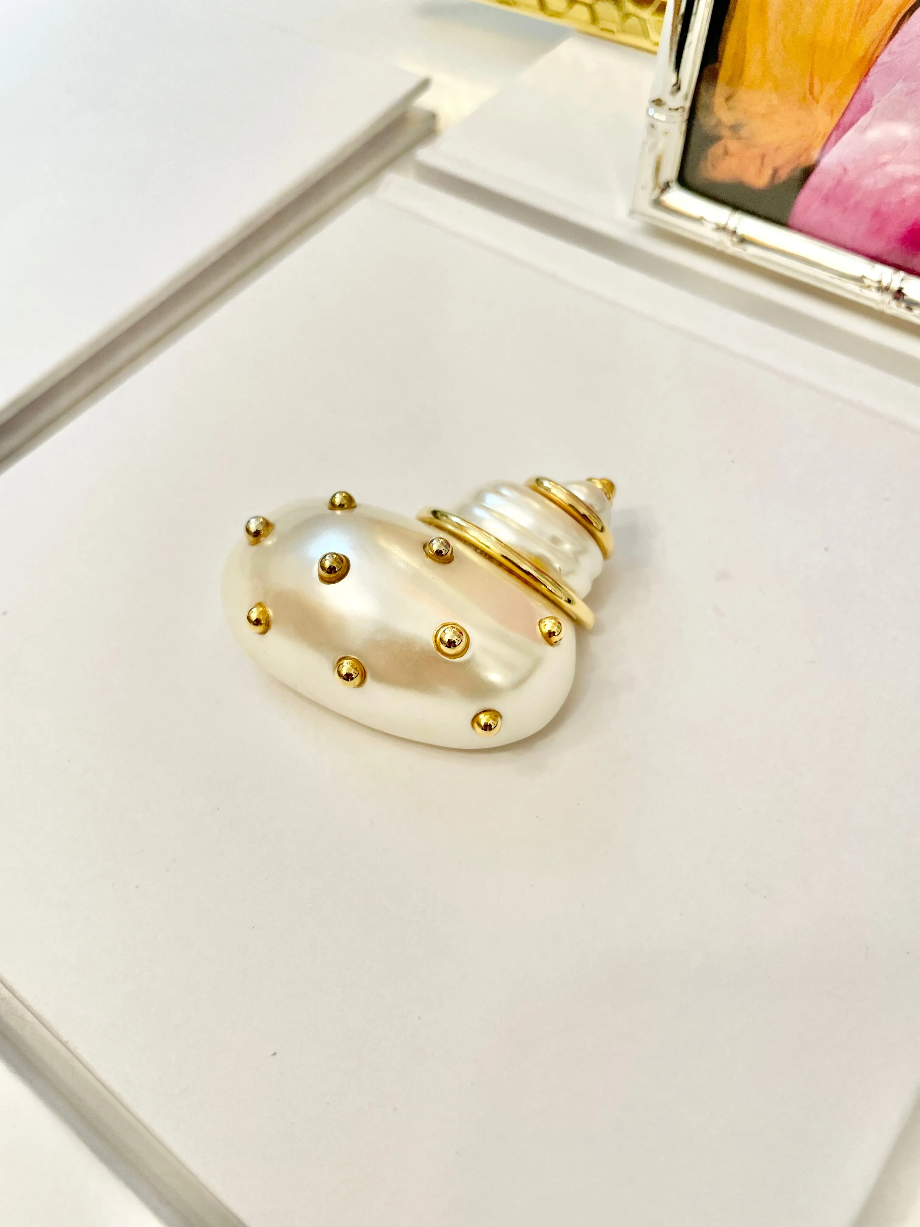 A Kenneth Jay Lane Classic! The classy shell brooch is just divine....