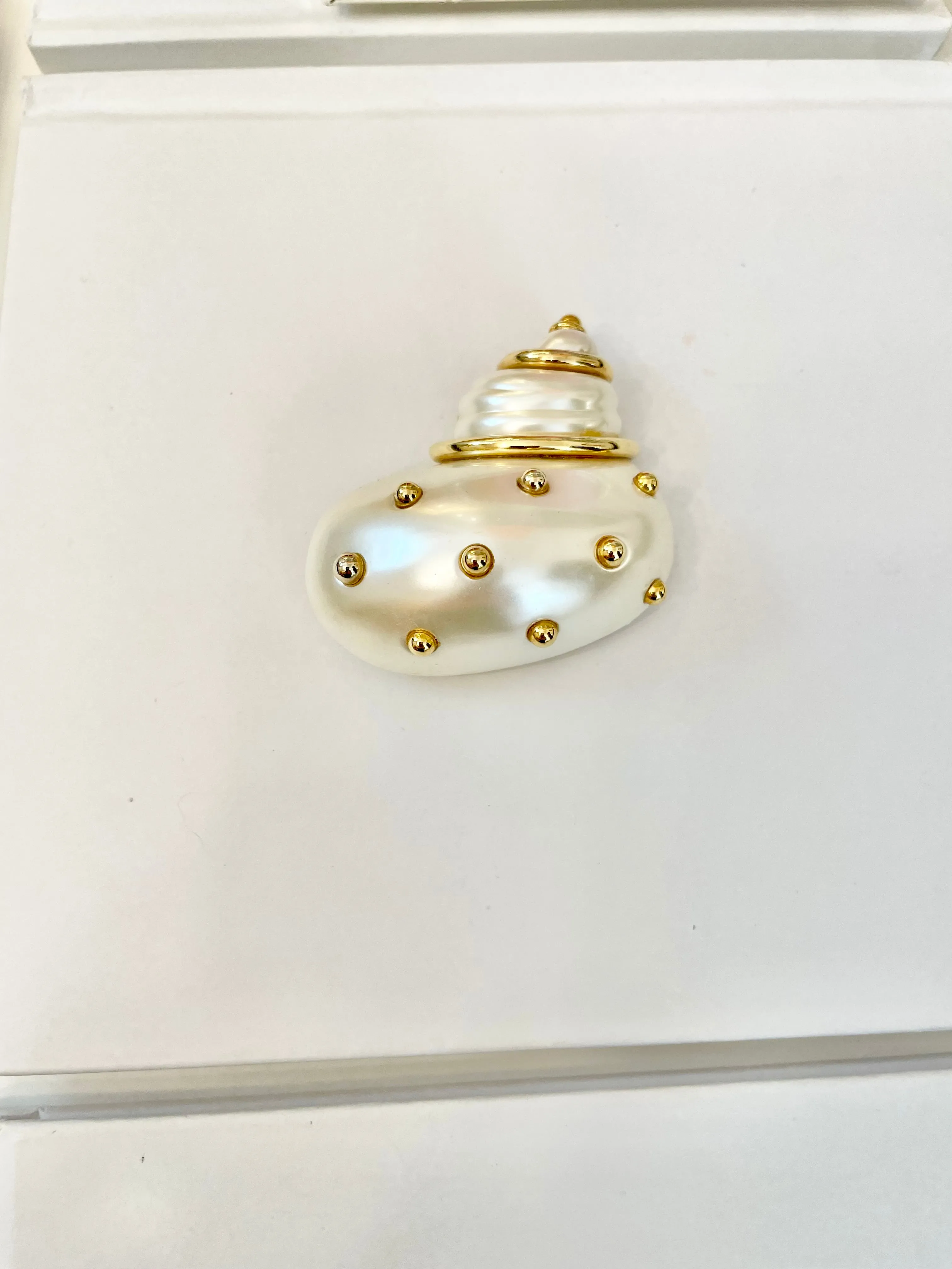 A Kenneth Jay Lane Classic! The classy shell brooch is just divine....