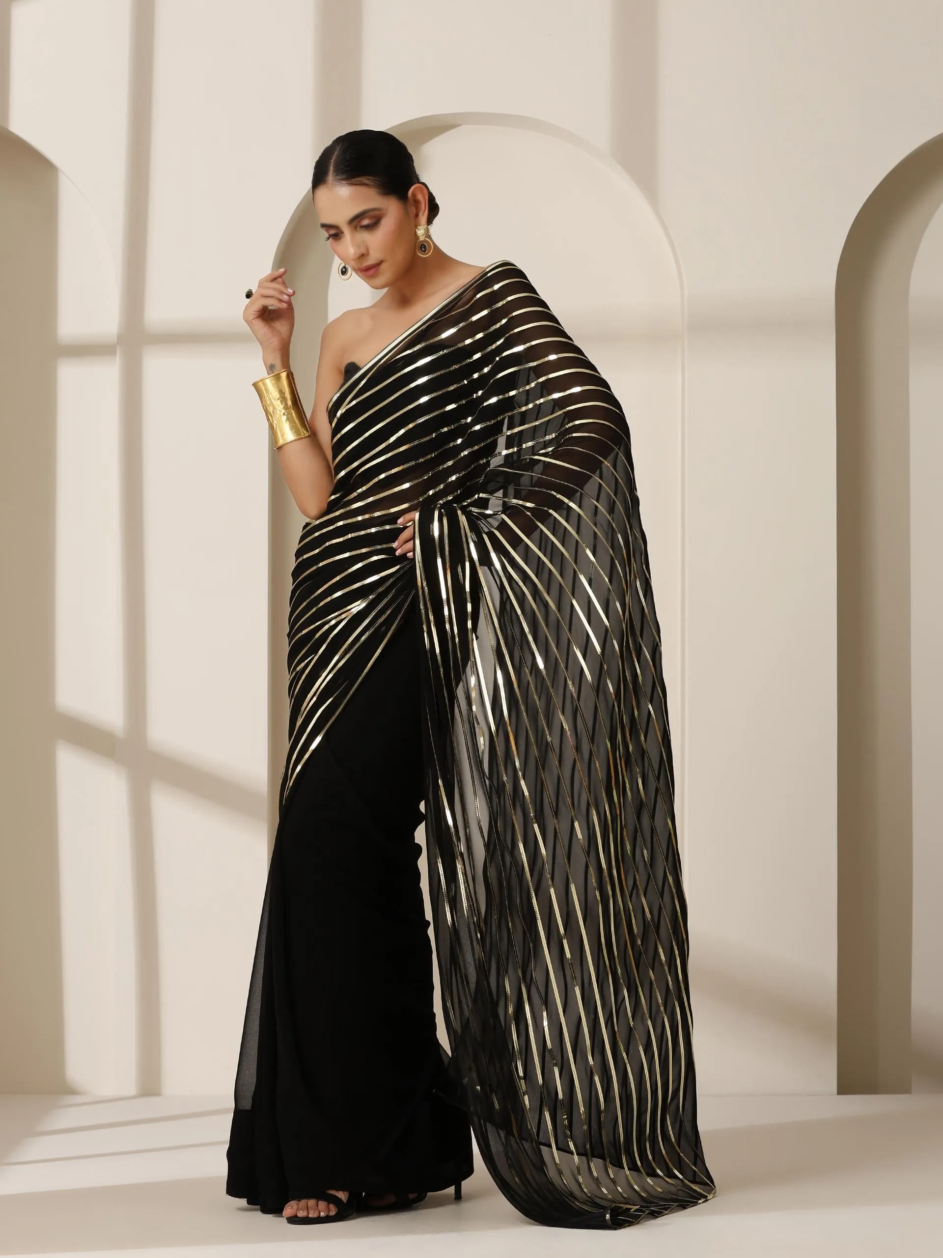 Black And Gold Impression Georgette Saree