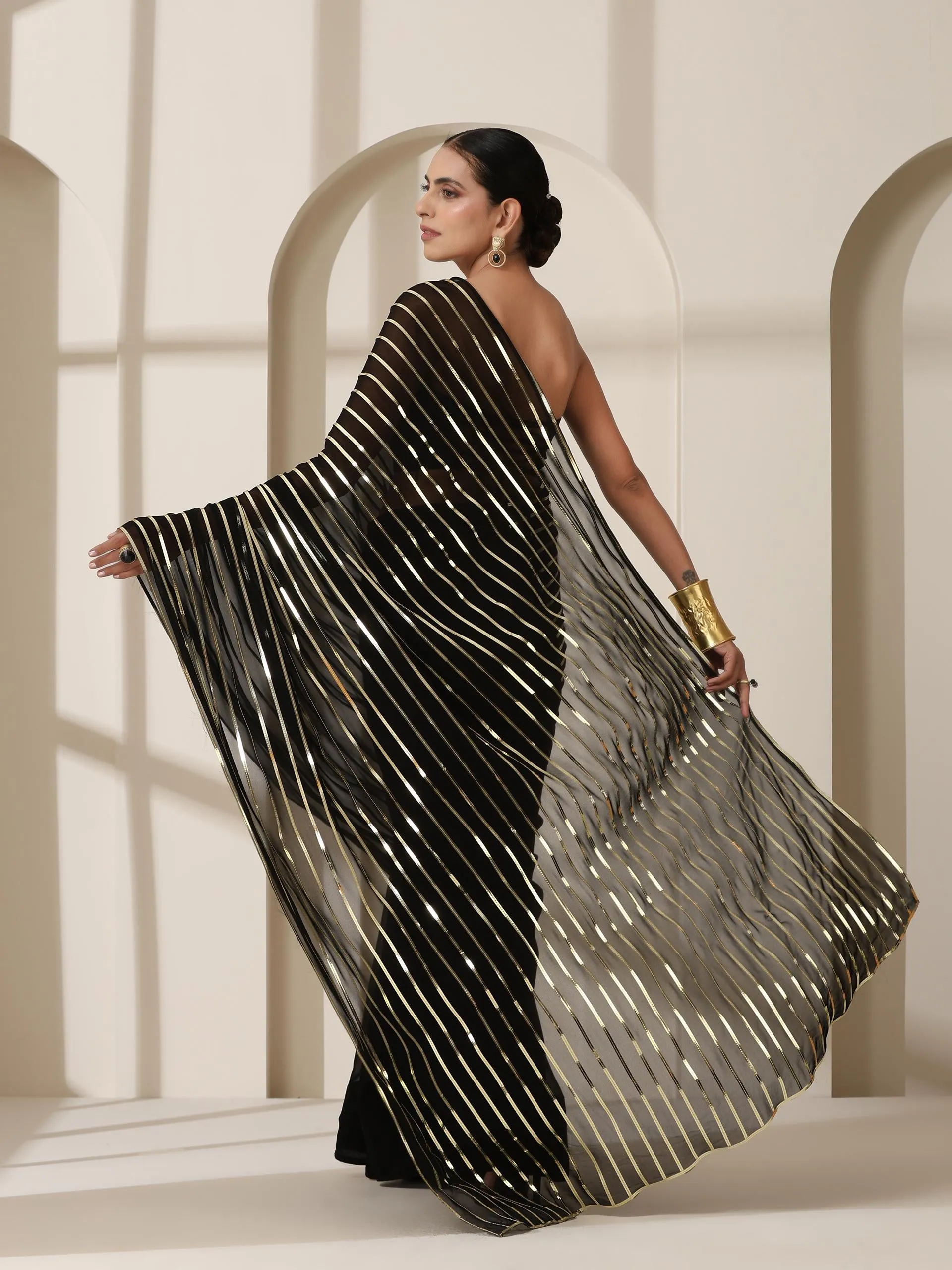 Black And Gold Impression Georgette Saree