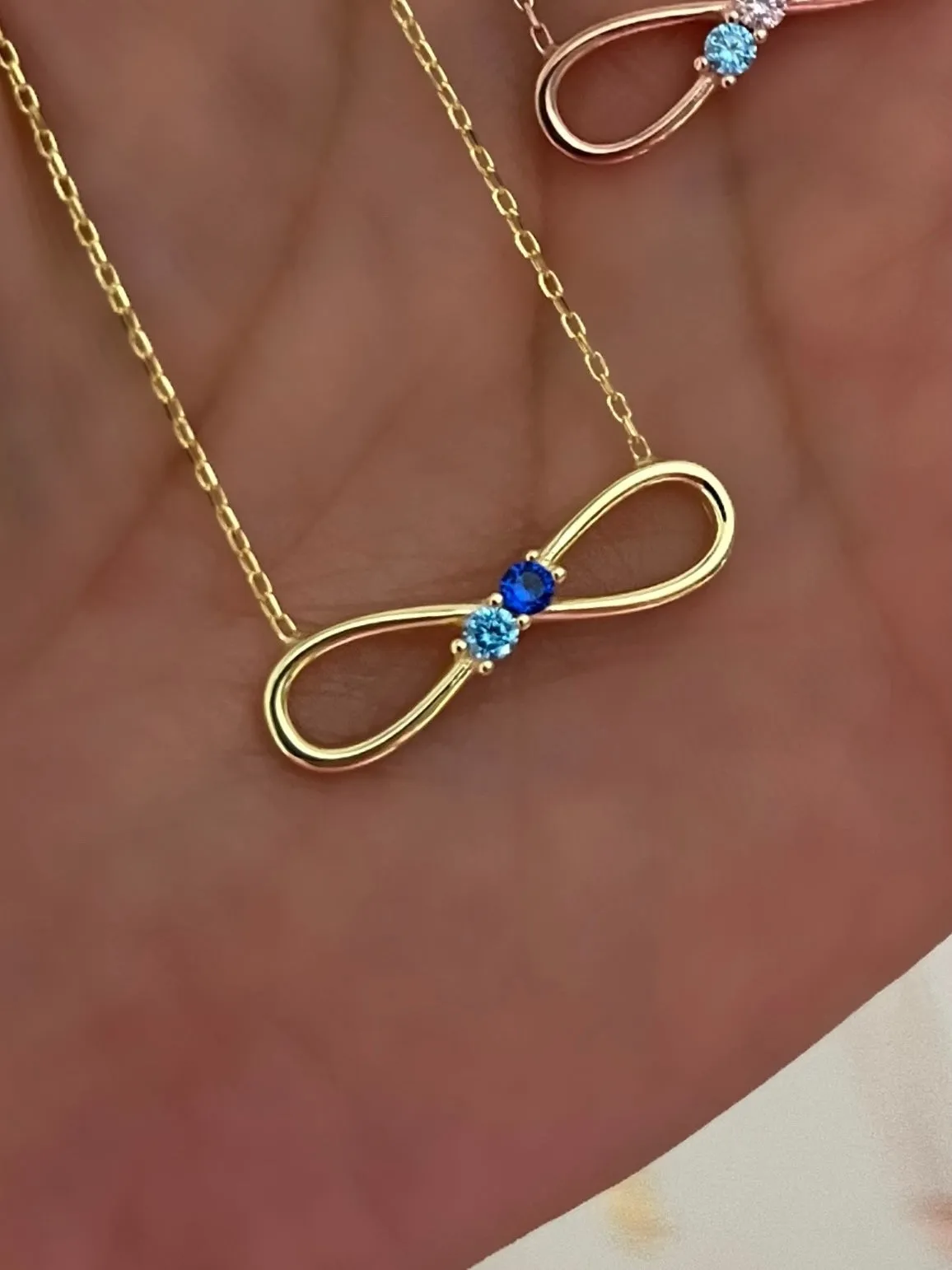 Minimalist infinity necklaces with rainbow stones